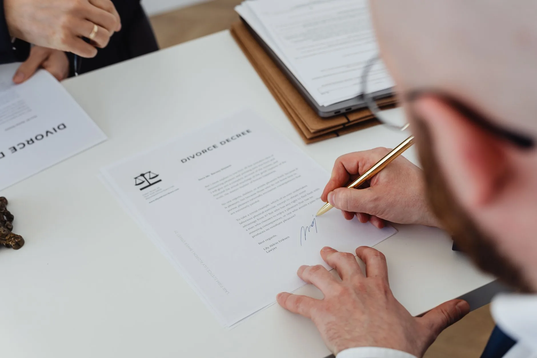 Hands on black desk verifying health insurance documents, official health insurance plan verification.
